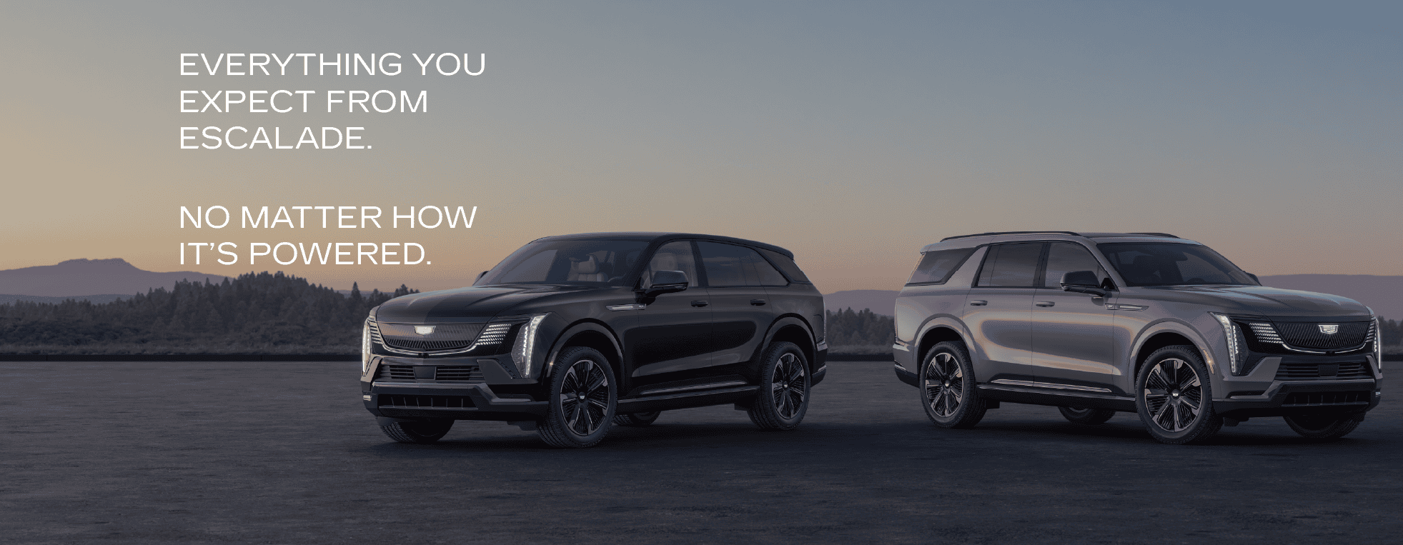 Two Cadillac Escalade SUVs parked at sunset, showcasing sleek design and versatility.